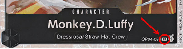 Der unterste Teil einer One Piece KArte auf der die Raritätssymbole hervorgehoben seid.